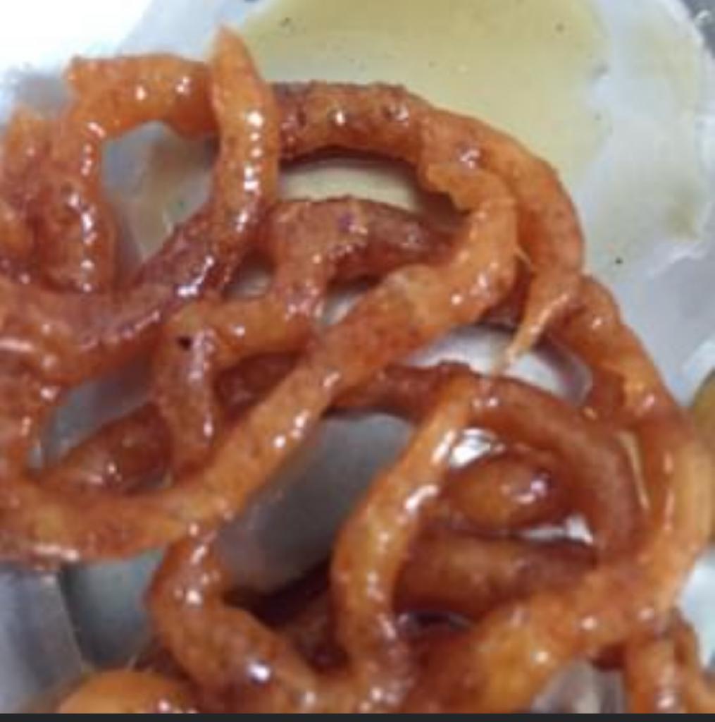 A mouth watering jalebi made up of jaggery. A popular street food of India. A famous morning breakfast