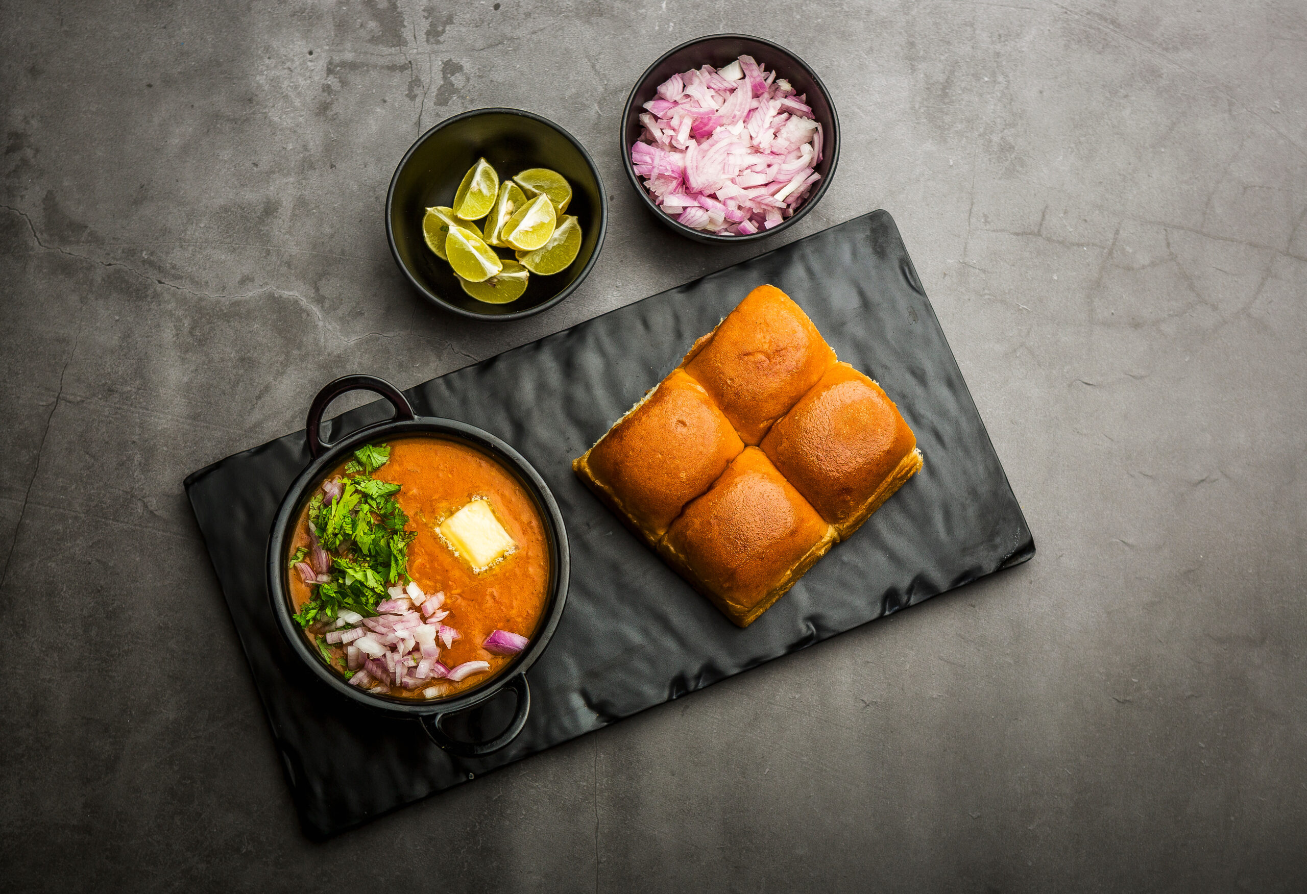 indian spicy fast food / snacks pav bhaji with bread, onion and butter