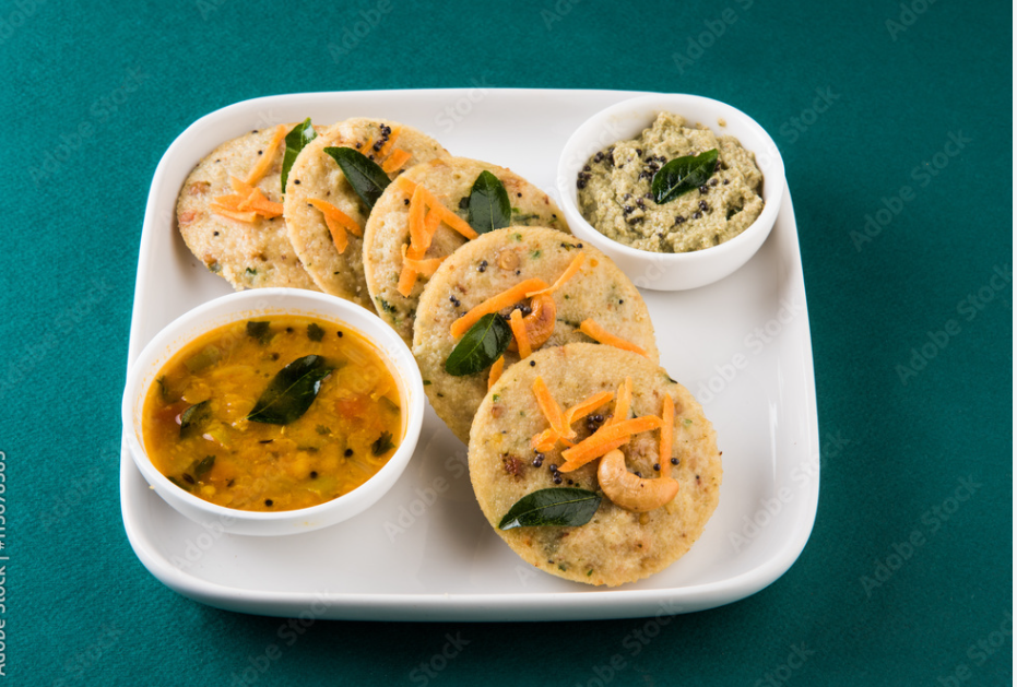 south indian favourite food rava idli or semolina idly or rava idly, served with sambar and green chutney