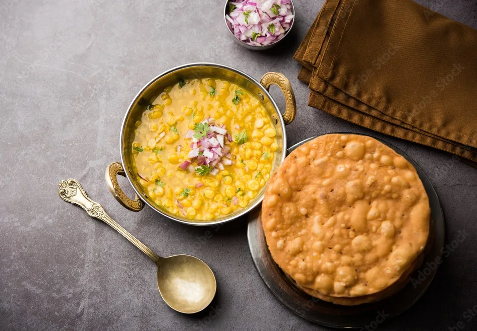 dal pakwan is an authentic sindhi breakfast. it is a combination of deepfried, crisp and unpuffed maida puris served with daal made using chana or split chickpea