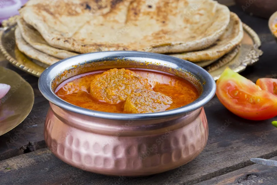 gatta curry also called gatte ki sabji or besan gatta is a rajasthan famous food served with chapati, onion, raita or papad