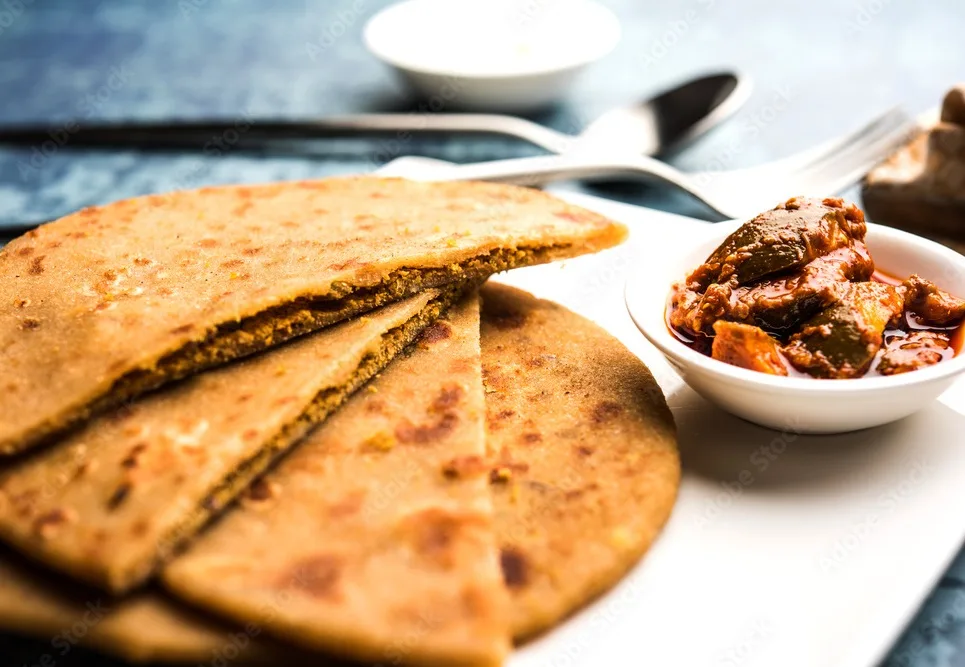 sattu ka paratha , stuffed channa dal flour paratha served with mango pickle and curd or dahi