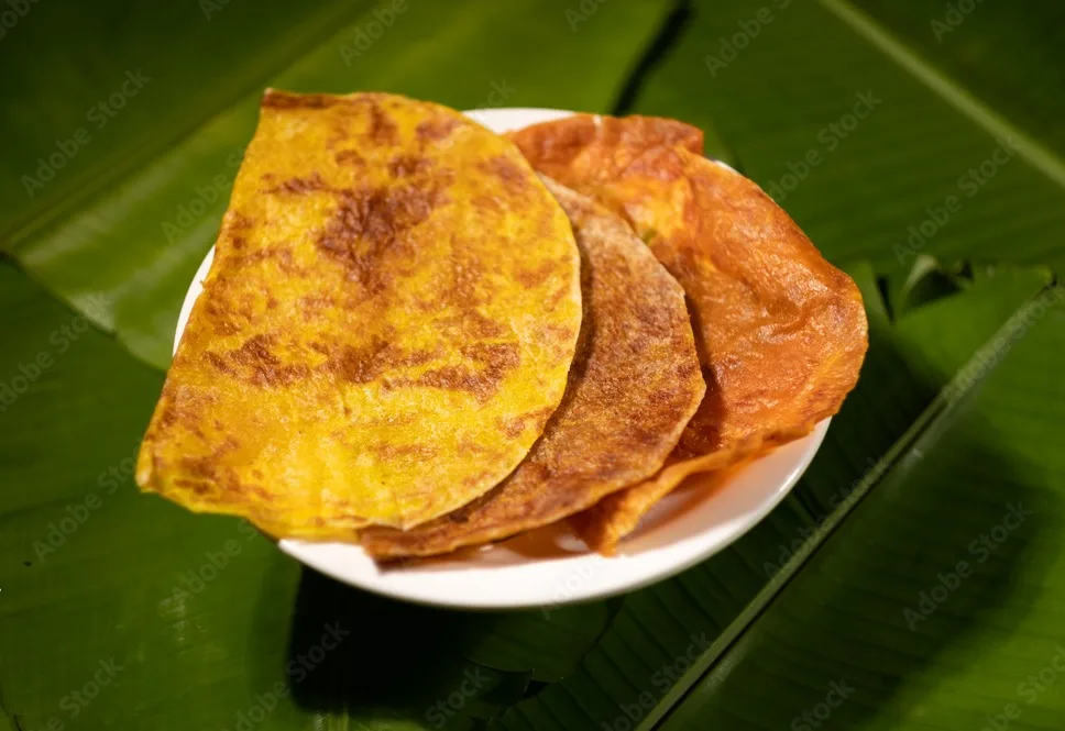 sweet flatbreads ( coconut flavors) originating from southern india (known locally as 'obbattu', 'puran puri', 'puran poli', 'holige', 'bobbattlu',