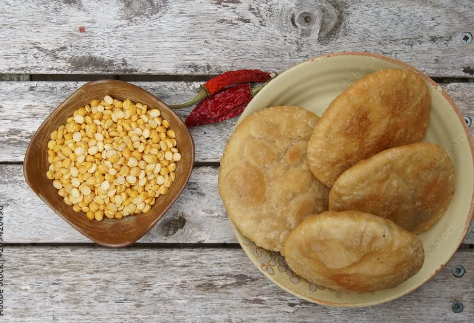 deep fried poori or kachauri with spicy lenti filling