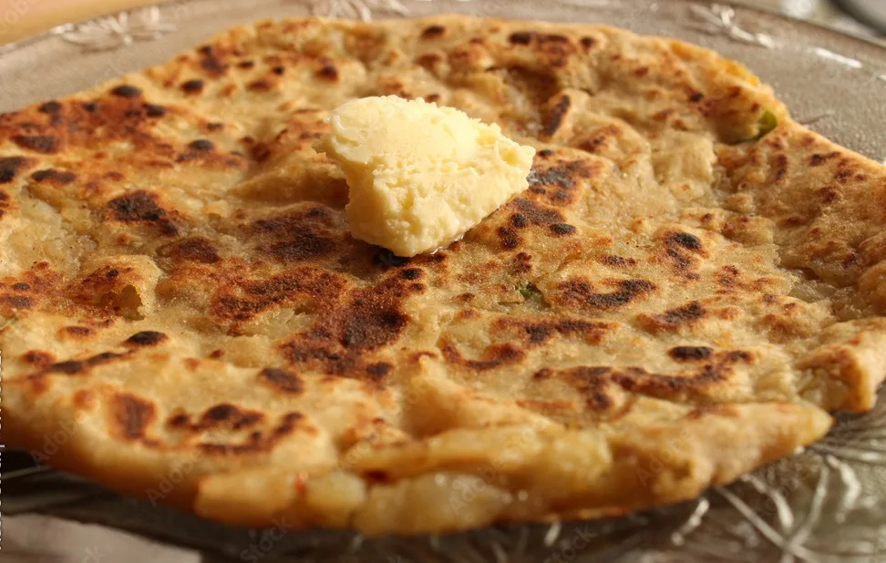 alu ka paratha with butter