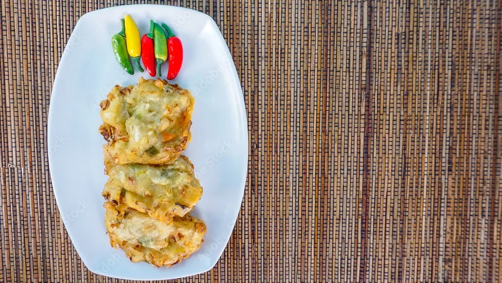 bakwan goreng, fried fritter made of wheat flour and vegetables.