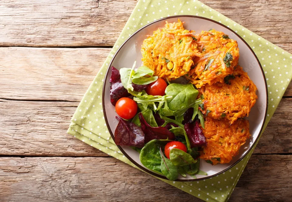 homemade fritters of lotus stem and fresh mix of salad