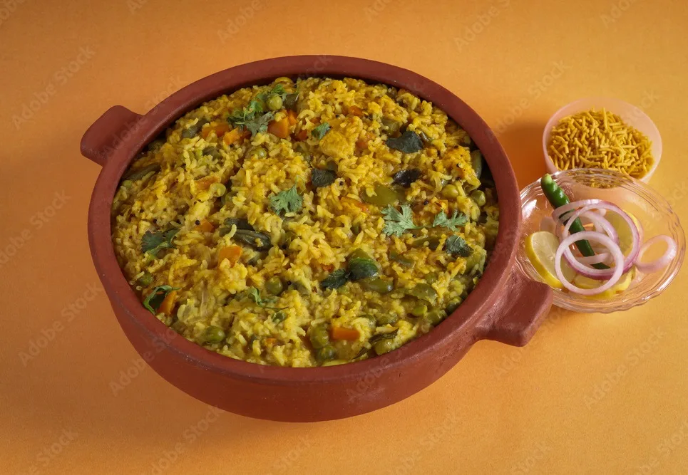 one pot preparation made of basmati rice, yellow mung lentils, blanched and pureed spinach and spices. commonly known as palak khichdi