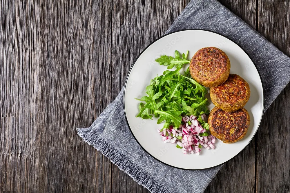 vegan lentil patties with rocket onion salad