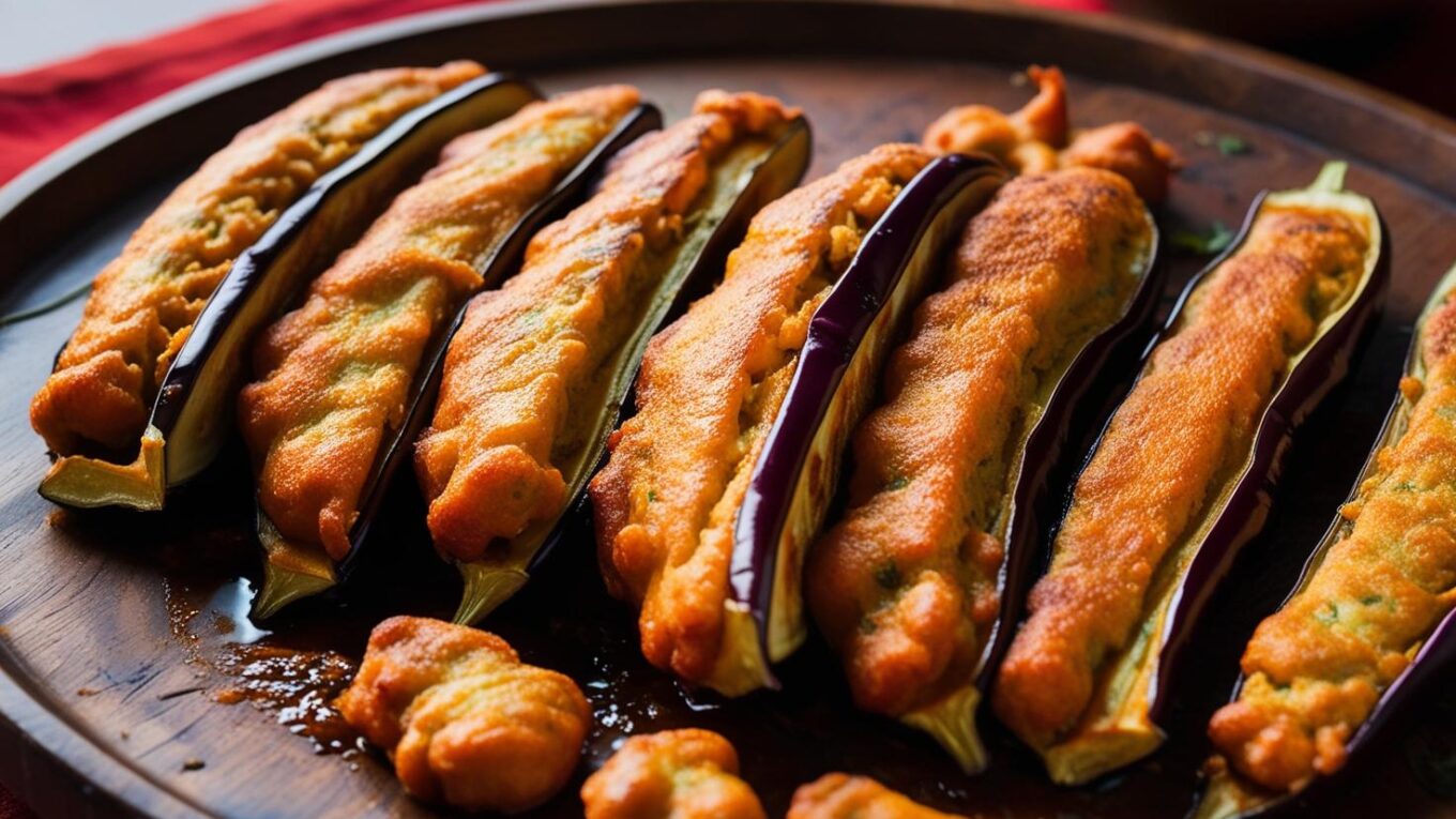 Beguni, or battered brinjal sliced lengthwise into fritters, is a beloved snack in Bengal and other parts of eastern India.